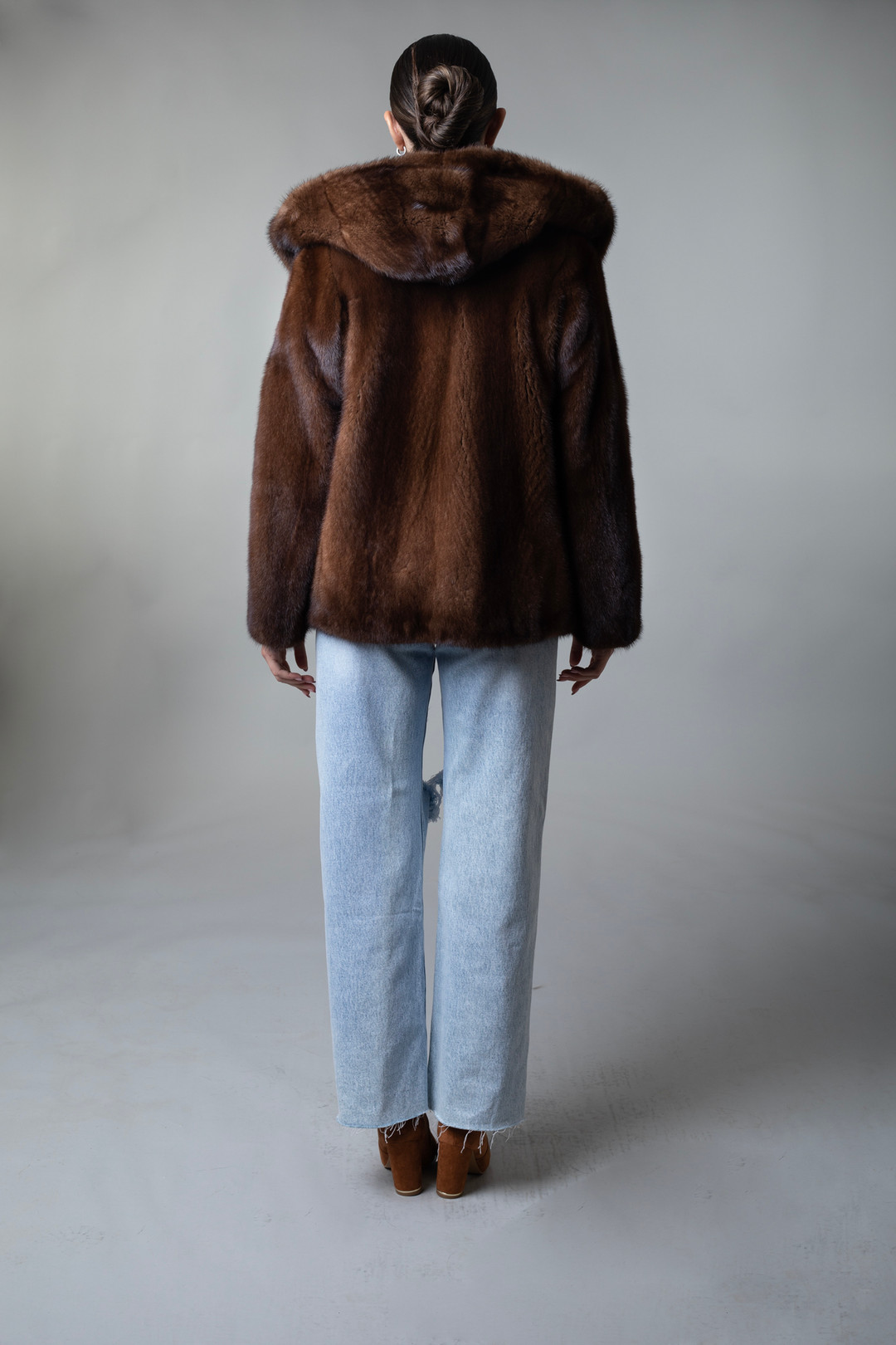 Mahogany Hooded Mink Fur Bomber Jacket on model rear view Mahogany Hooded Mink Fur Bomber Jacket on model rear view