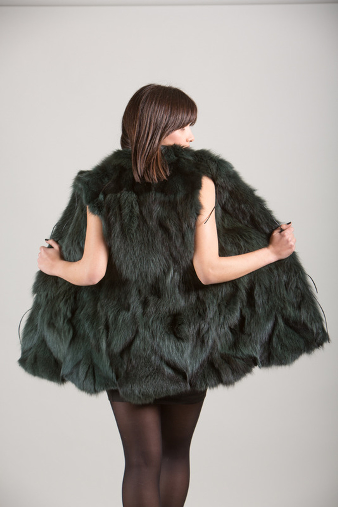 Green Fox Fur Vest in brunette model rear view Green Fox Fur Vest in brunette model rear view