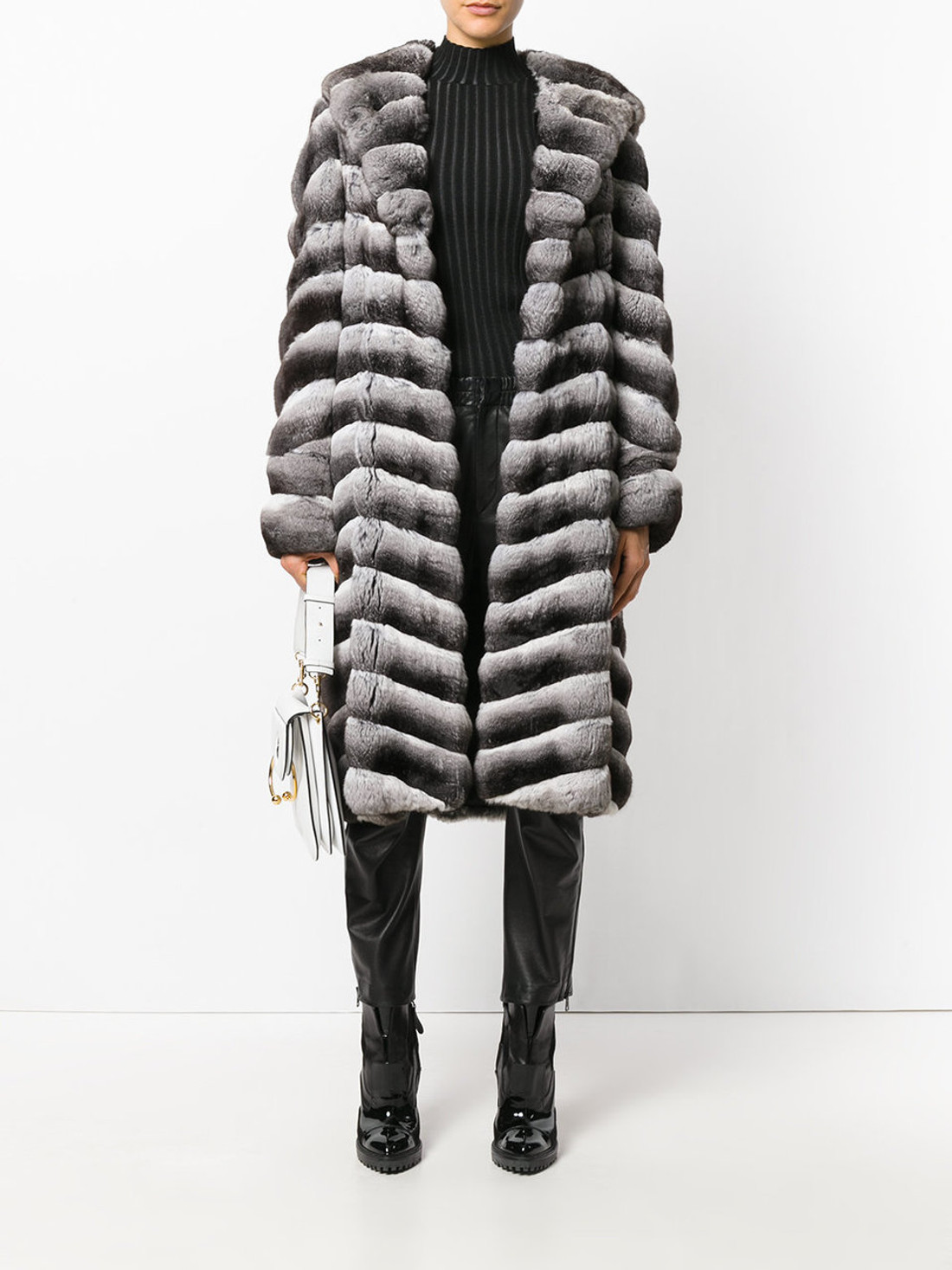 long chinchilla coat , turtleneck collar  combined with black striped blouse and knee height synthetic boots