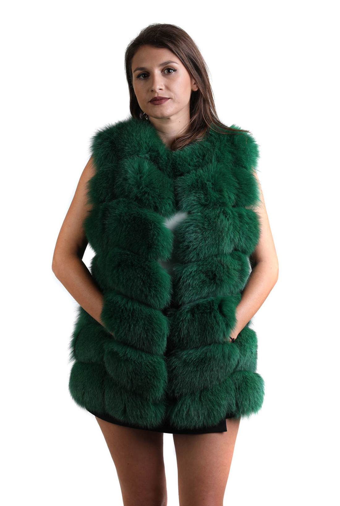 cypress green fox fur vest on model with black mini skirt and white blouse
