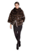 brown sable fur jacket on model wearing black mini skirt with pelts stiched across and brown silk belt brown sable fur jacket on model wearing black mini skirt with pelts stiched across and brown silk belt