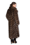 rear profile view of full length light russian sable fur coat on model with black heels