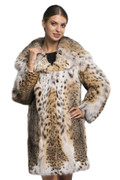 knee length lynx fur coat with hood ending on v-neck collar , tapered waist , on model wearing mini skirt and black leather heels