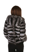 rear view of short hooded chinchilla fur coat on redhead model