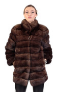 brown sbale fur coat mid hip length , with pelts stiched horizontally , rounded collar on blonde model wearing leather pants brown sbale fur coat mid hip length , with pelts stiched horizontally , rounded collar on blonde model wearing leather pants