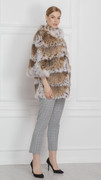 lynx fur coat with cropped sleeves on model with gray croped cotton pants and black high heels lynx fur coat with cropped sleeves on model with gray croped cotton pants and black high heels