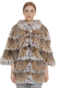 lynx fur coat stitched with skins acrooss elbow length sleeves and white lynx collar on blond model with checked cotton pants and elegant haircut lynx fur coat stitched with skins acrooss elbow length sleeves and white lynx collar on blond model with checked cotton pants and elegant haircut