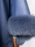 blue cashmere cape with fox trim close up blue cashmere cape with fox trim close up