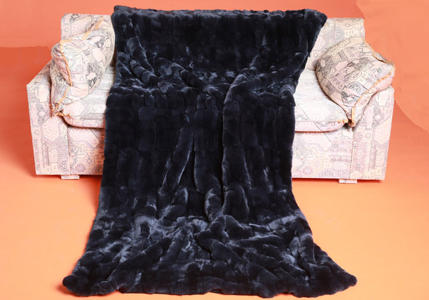 navy rex fur blanket throw on sofa