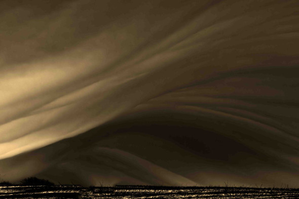 Dramatic Storm Clouds Over Open Landscape by Josh Blackman