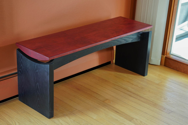 Red and black bench with floating top by Alan Kalker
