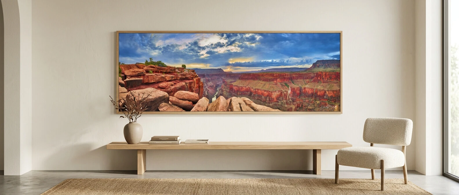 Panoramic canyon landscape artwork displayed above a console table in a contemporary living space
