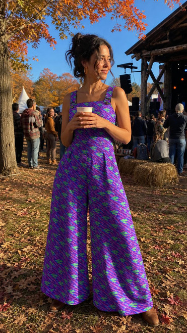 Purple Dinosaur wide leg jumpsuit front view at fall festival