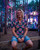 PLUR Neon Daisy Button Up Shirt worn in forest light installation at festival