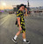 Don't Worry Be Happy Smiley Face Shirt and Shorts Set worn near festival main stage at sunset