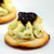 Delicious sweet figs slow cooked in a balsamic vinegar reduction and a hand piped flower of creamy goat cheese & chive set atop a Focaccia round.


Units/case: 60
