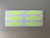 Sheet of oval-shaped glow-in-the-dark stickers arranged in two rows on a white backing.