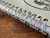 Close-up of a spiral-bound notebook showing the metal coil binding and stacked pages.