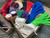 Open box containing multiple bundles of paracord in red, blue, green, and black, along with smaller cords and a drawstring bags.