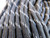 Close-up of paracord sheath showing woven nylon texture with reflective tracer fibers embedded.