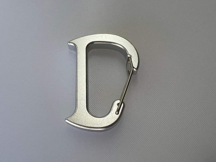 Large MicroFin carabiner on a white background, showing its extended D-shaped frame and spring gate design.