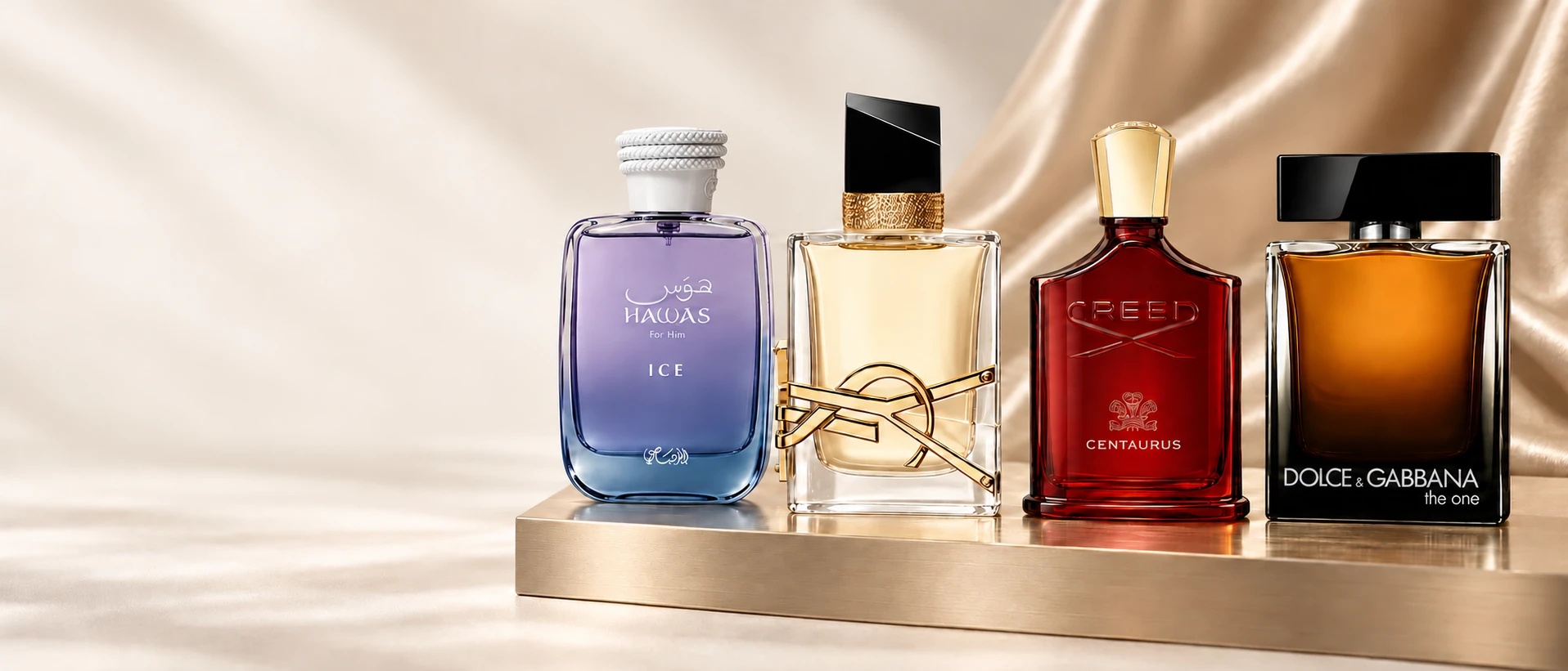 Hawas Ice, YSL Libre, Creed Centaurus and Dolce & Gabbana The One on a gold shelf