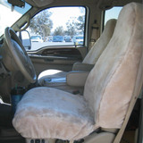 Tailor-made Sheepskin Seat Covers installed on front seats in a truck, plush full-coverage comfort and protection.