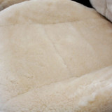 Close-up of Tailor-made Sheepskin Seat Covers seat cushion, showing thick plush pile and soft natural texture.