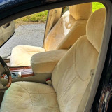 Tailor-made sheepskin seat covers installed on classic car front seats, featuring gold natural sheepskin for a luxurious look and enhanced driving comfort.