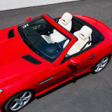 Red sports car interior with custom sheepskin seat covers