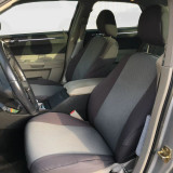 OEM Seat Covers installed on front seats in a vehicle, factory-style two-tone look with full coverage.