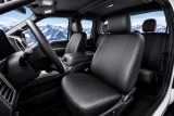 Black Pro-Tect Vinyl Seat Covers installed in a truck, durable full-coverage vinyl protection for front and rear seats.