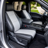 Imitation Leather seat covers on truck front buckets, black sides with gray horizontal-stitched center panels.