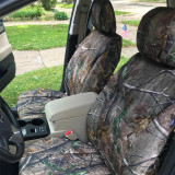 Mossy Oak Waterproof Camo Seat Covers installed on front seats in a truck, full-coverage camo with custom-fit look.
