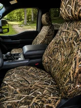 Mossy Oak Waterproof Camo Seat Covers installed on front seats in a truck with waterfowl reeds camo pattern.