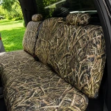 Mossy Oak Waterproof Camo seat covers on truck rear bench, Shadow Grass Blades camo on backrest, cushion, and two headrests.