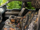 Mossy Oak Waterproof Camo seat covers on truck 40/20/40 bench, woodland camo on seats, console, headrests, and wheel.