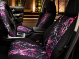 Moon Shine Waterproof Camo seat covers on front buckets, pink camo inserts with black bolsters and matching wheel wrap.