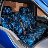 Moon Shine seat covers on truck front bench, blue branch camo covering seats and headrests in a matching blue truck.