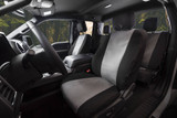 Atomic Pro-Tect Seat Covers front seat view in a truck, durable two-tone gray and black protection with a custom- Image 600 denier waterproof polyester/40 cotton blend.