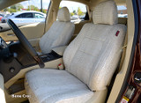 Exotic Seat Covers (Bone Croc) installed on a front seat, featuring a clean cream-colored crocodile skin embossed pattern.