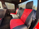Exotic seat covers in Midnight Croc with Flame Croc on rear bench, red croc centers, black bolsters, front seat map pocket.