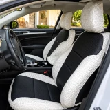 Exotic Seat Covers (Bone Croc w/ Perforated Sof-Touch Black Inserts) on front bucket seats with a tailored fit.
