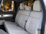 Infographic showing Sof-Touch Leatherette Seat Covers features: side airbag/heated seat compatible, headrest covers, pockets, and access to controls.