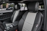 Sof-Touch Leatherette Seat Covers installed on a rear bench seat, smooth leatherette with a tailored fit and seat belt access.