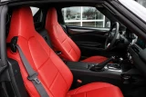 Sof-Touch Leatherette Seat Covers installed in a sports car, premium red leatherette for a sleek custom-fit look.