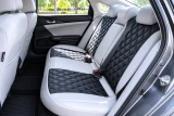 Sof-Touch Leatherette Seat Covers installed in a luxury vehicle, black and gray leatherette with a sleek custom-fit finish.