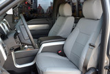 Sof-Touch Leatherette Seat Covers rear/angled view showing tailored fit, rear storage pockets, and center console access.