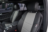 Sof-Touch Leatherette Seat Covers installed on a rear bench seat, smooth leatherette with a tailored fit and seat belt access.