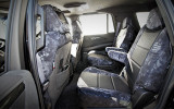 Luxury Line Kryptek Camo Seat Covers installed on rear seats, Kryptek Typhon camo with black perforated center panels.